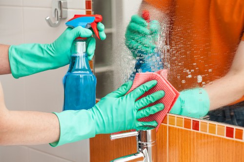 Carpet cleaning technician preparing safe equipment for a residential service