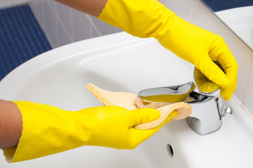 Cleaner handling equipment and chemicals safely on site